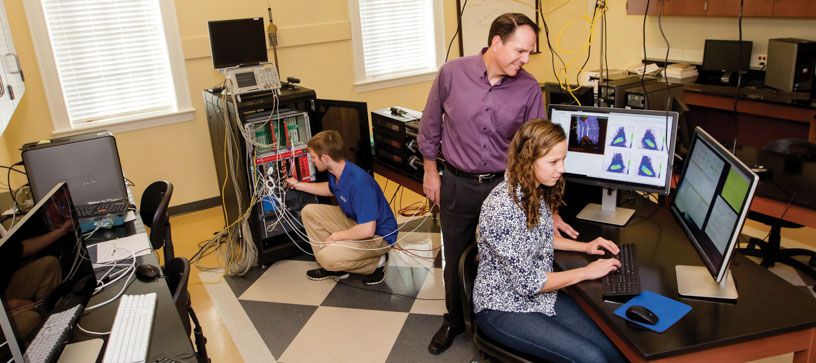 Dr. Brash working with students