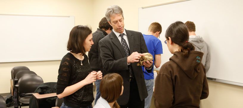 Dr. Loy working with anthropology students in class
