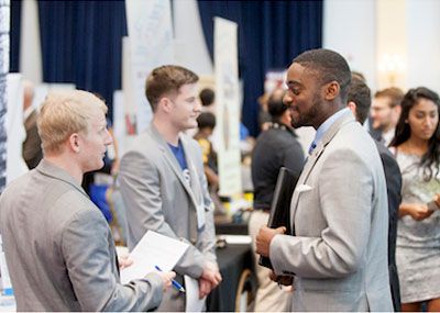 A student talks to a prospective employer.