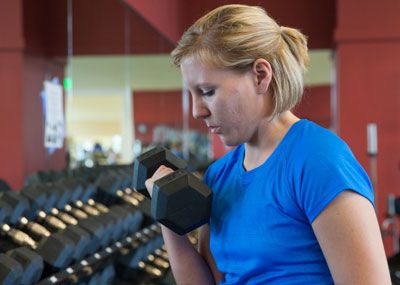 Girl lifting free weights