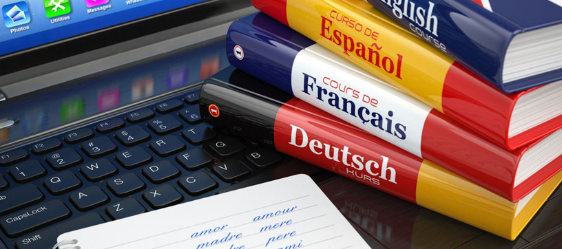 Language course books with laptop