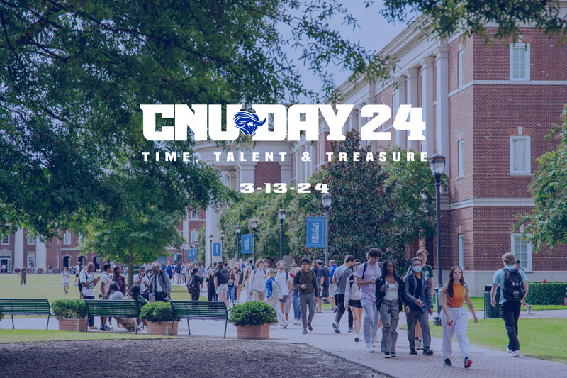Students walking on campus. A blue translucent hue is over the picture with the white CNU Day logo in the foreground.