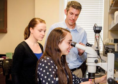 Dr. Christopher Meighan with students