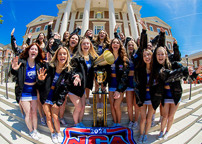 CNU Cheerleading posing with their national championship trophy