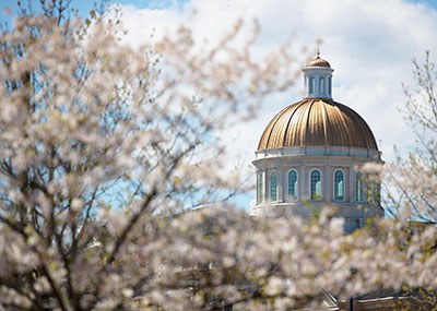Christopher Newport Hall dome and cherry blossoms