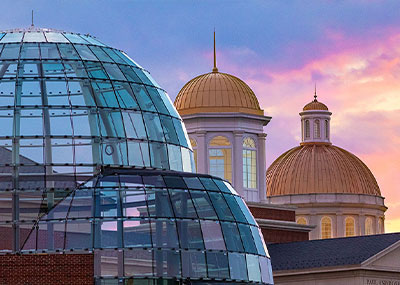 Fine Arts Center domes and library cupolas at sunset