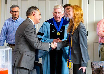 Students are inducted into Beta Sigma Gamma