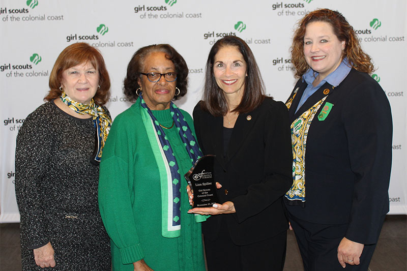 Dr. Lisa Spiller (second from right) with representatives of Girl Scouts of the Colonial Coast