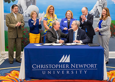 Presidents Paul Trible (left) and John Dever after signing the Captains Connection agreement