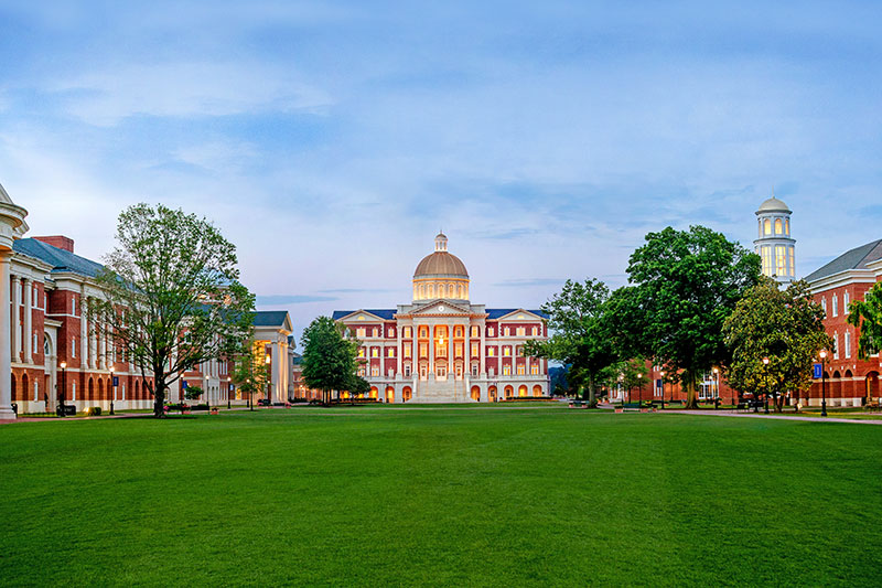 Wide shot of Christopher Newport Hall from the Great Lawn at dusk