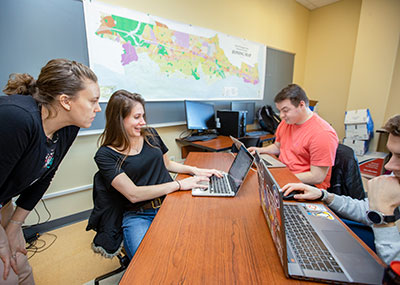 Dr. Jessica Kelly (left) and CNU PIC Math students.