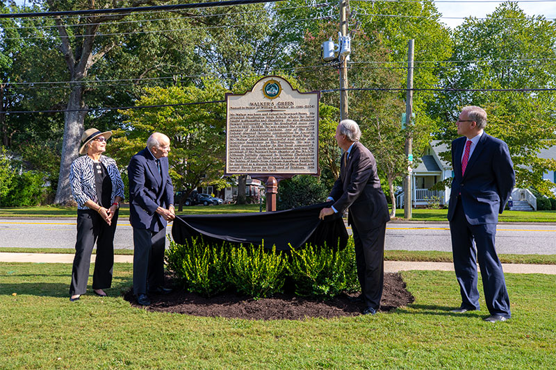 Howard K. Walker and his wife Terry help President Trible unveil the historic marker honoring William R. Walker Jr. and 'Walker's Green.'
