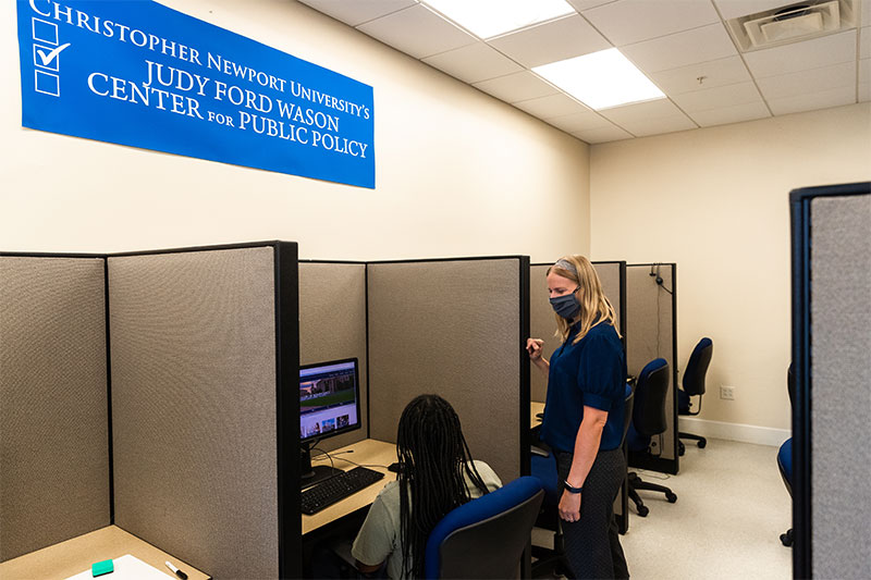 Rebecca Bromley-Trujillo works with a student in the Wason Center survey lab