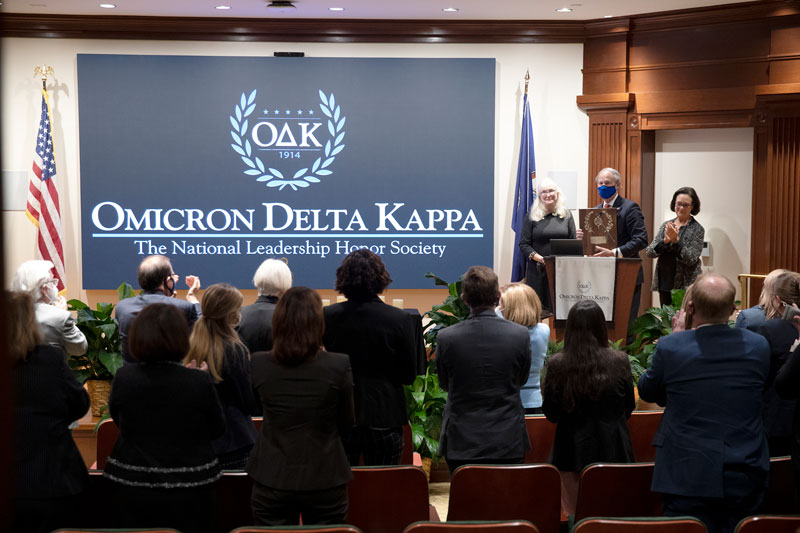 President Paul Trible Receives the Laurel Crowned Circle Award from Omicron Delta Kappa representatives.