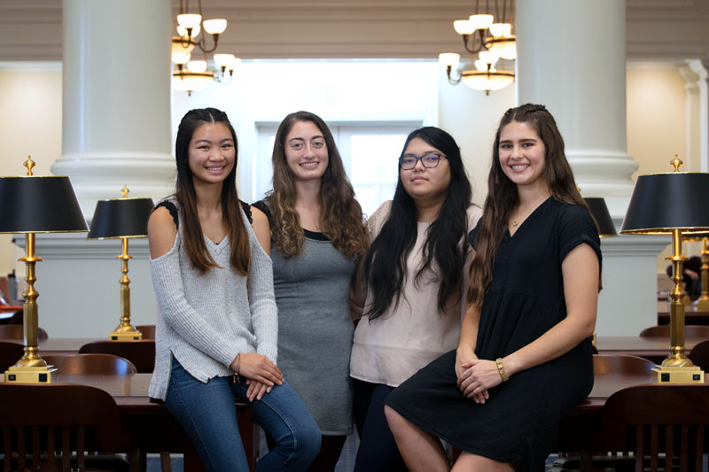 From left to right: Bianca Londres, Adrianna DeSantis, Phyu Chaw, Sydney King in the Trible Library