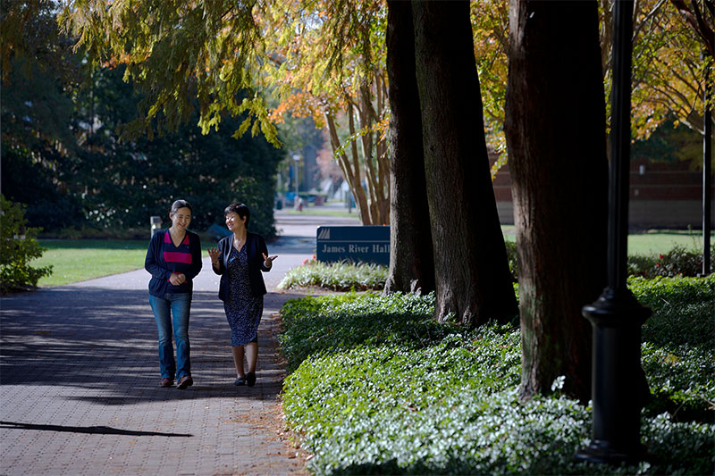 Hong Ying and Xin Ma walking on campus at Christopher Newport