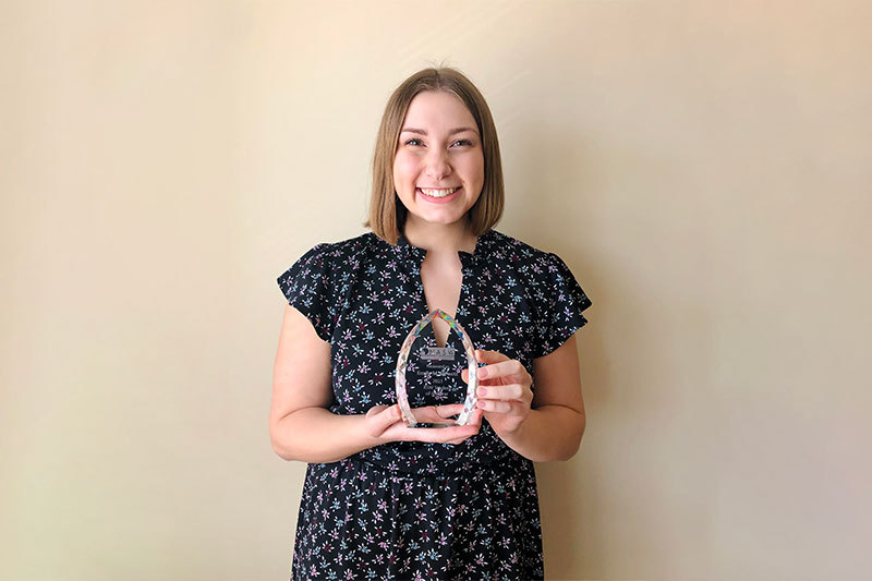 Emily Hewett with her Social Work Student of the Year Trophy