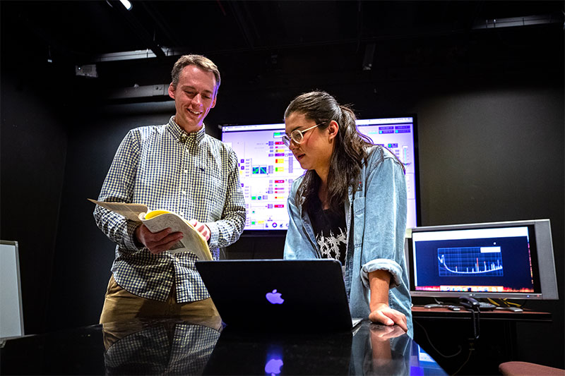 Kaemon Watada (right) with Dr. Ryan Fisher in the LIGO lab on campus at CNU