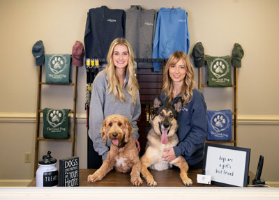 Morgan Strack (left) and Katie Eaton with two dogs