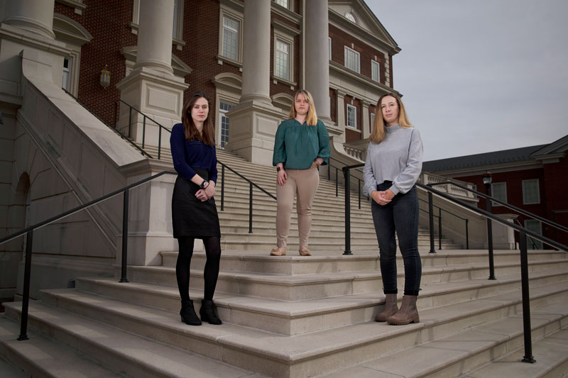 Photo of Victoria Sampson, Emma Snyder and Allison Schurr (left to right) on the steps of Christopher Newport Hall