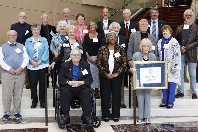 Members of Christopher Newport College's classes of 1970, 1971 and 1972 pose for a picture.