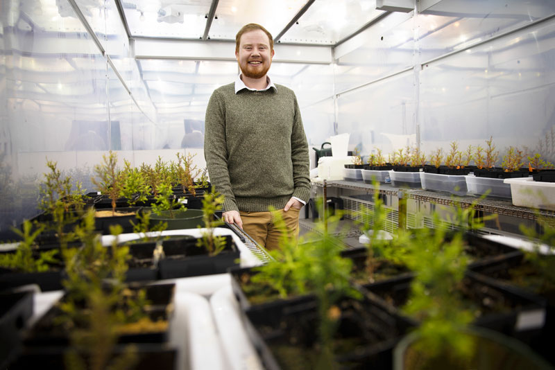 Patrick Wright in the Christopher Newport greenhouse