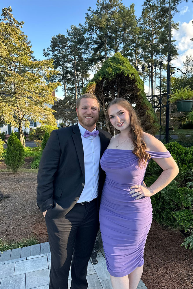 Jordan and Kimberly in formal attire outdoors