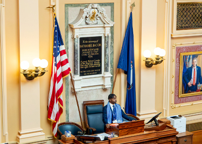 A CNU Student stands at the podium in the Virginia General Assembly.
