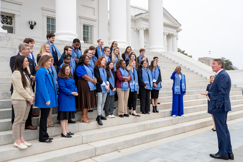 Governor Glen Youngkin addresses students and local legislators on the steps of the capital building in Richmond.