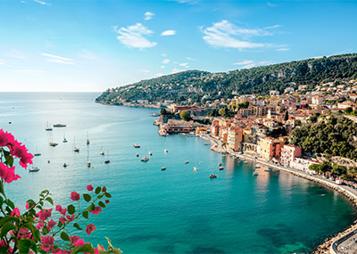 A view of the French Riviera water and buildings along the coast