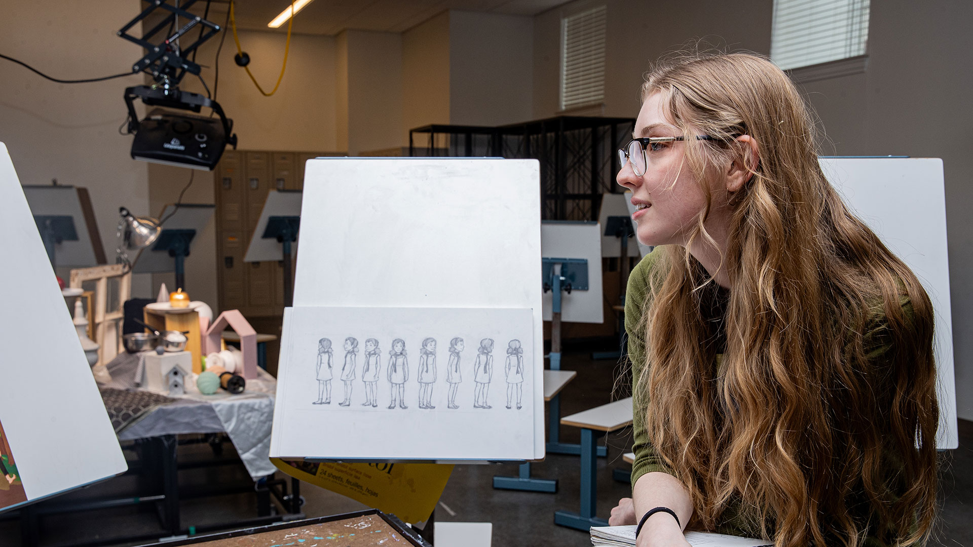 Art student with a drawing pad in an art studio