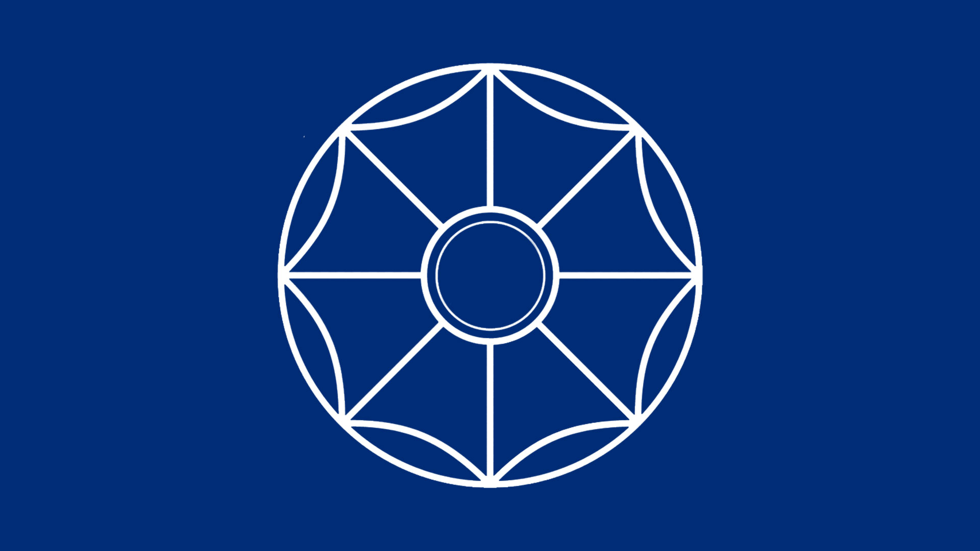A white, eight-spoked wheel design, resembling a dharma wheel or stylized flower, centered on a solid dark blue background.