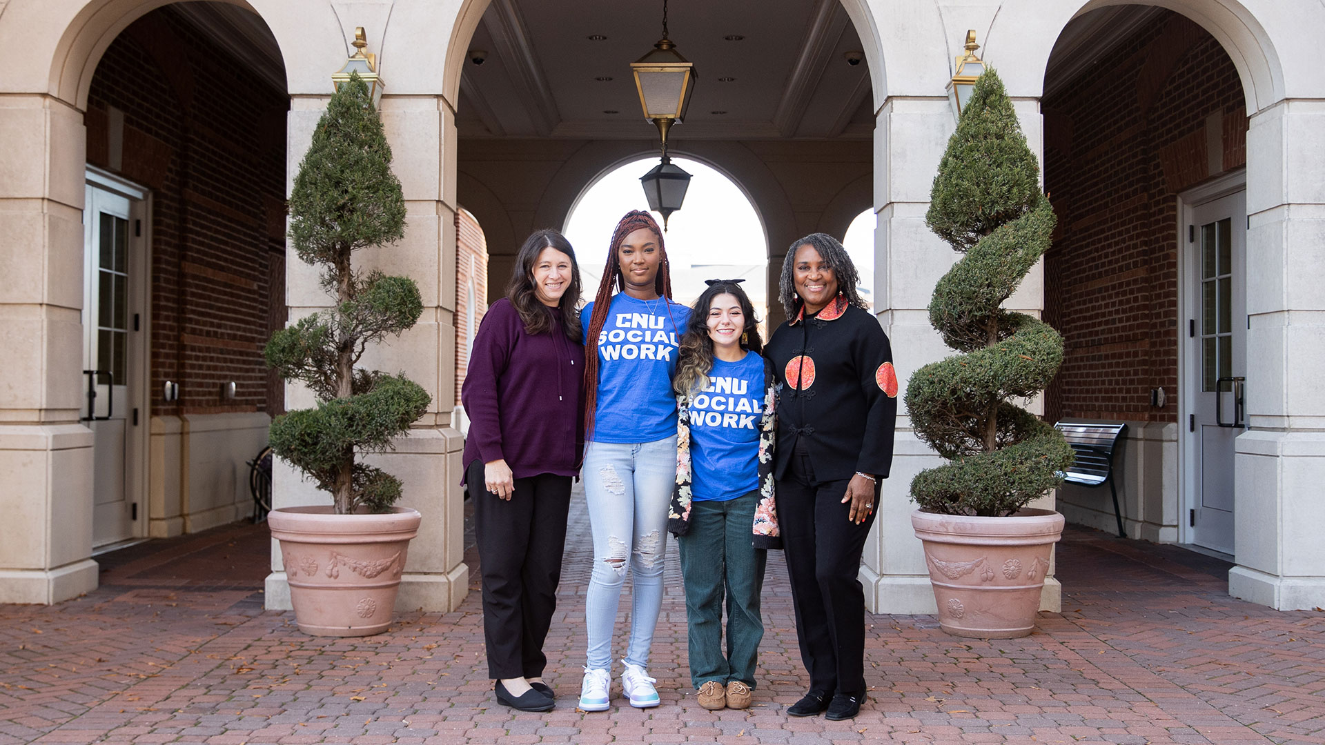 Social Work student pose for a shot wearing their CNU Social Work shirts