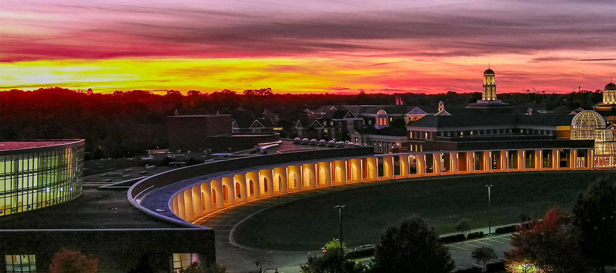 Wide shot of Ferguson Center for the Arts and Torggler Fine Arts Center at sunset