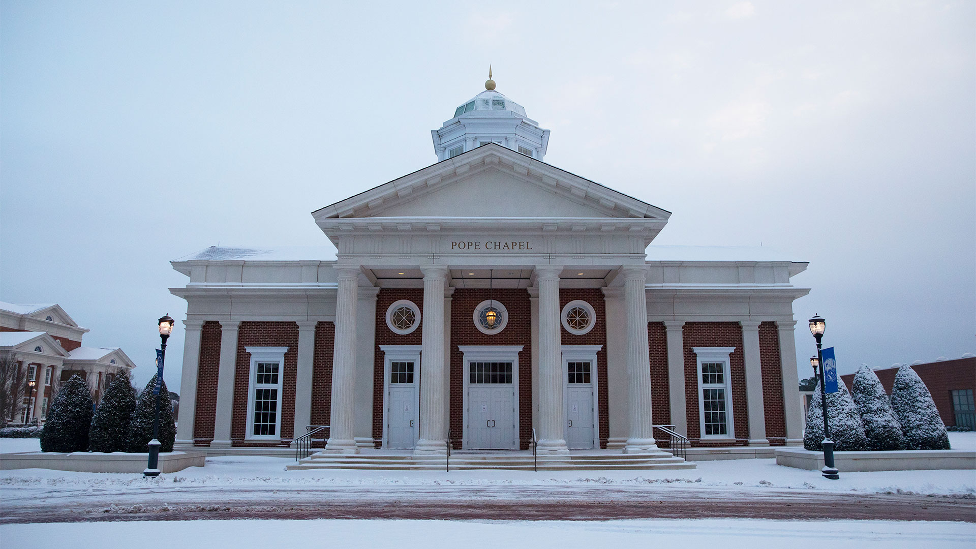 Pope Chapel covered in snow on a cloudy day