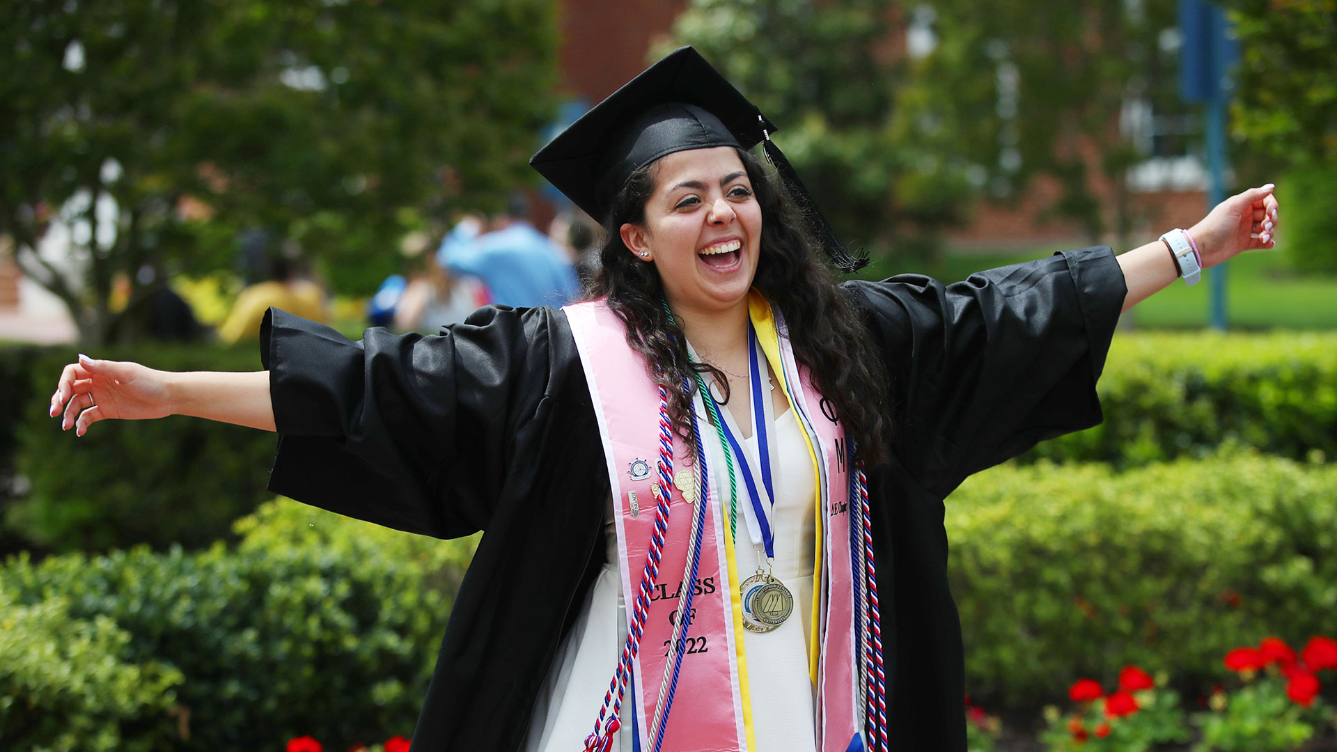 Happy student at commencement in regalia