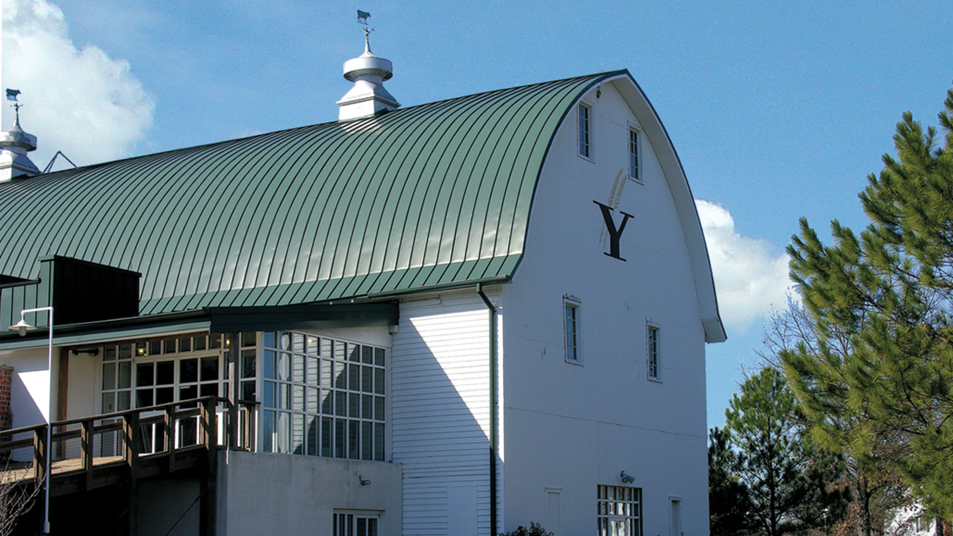 Exterior shot of the Yoder Barn against a blue sky.