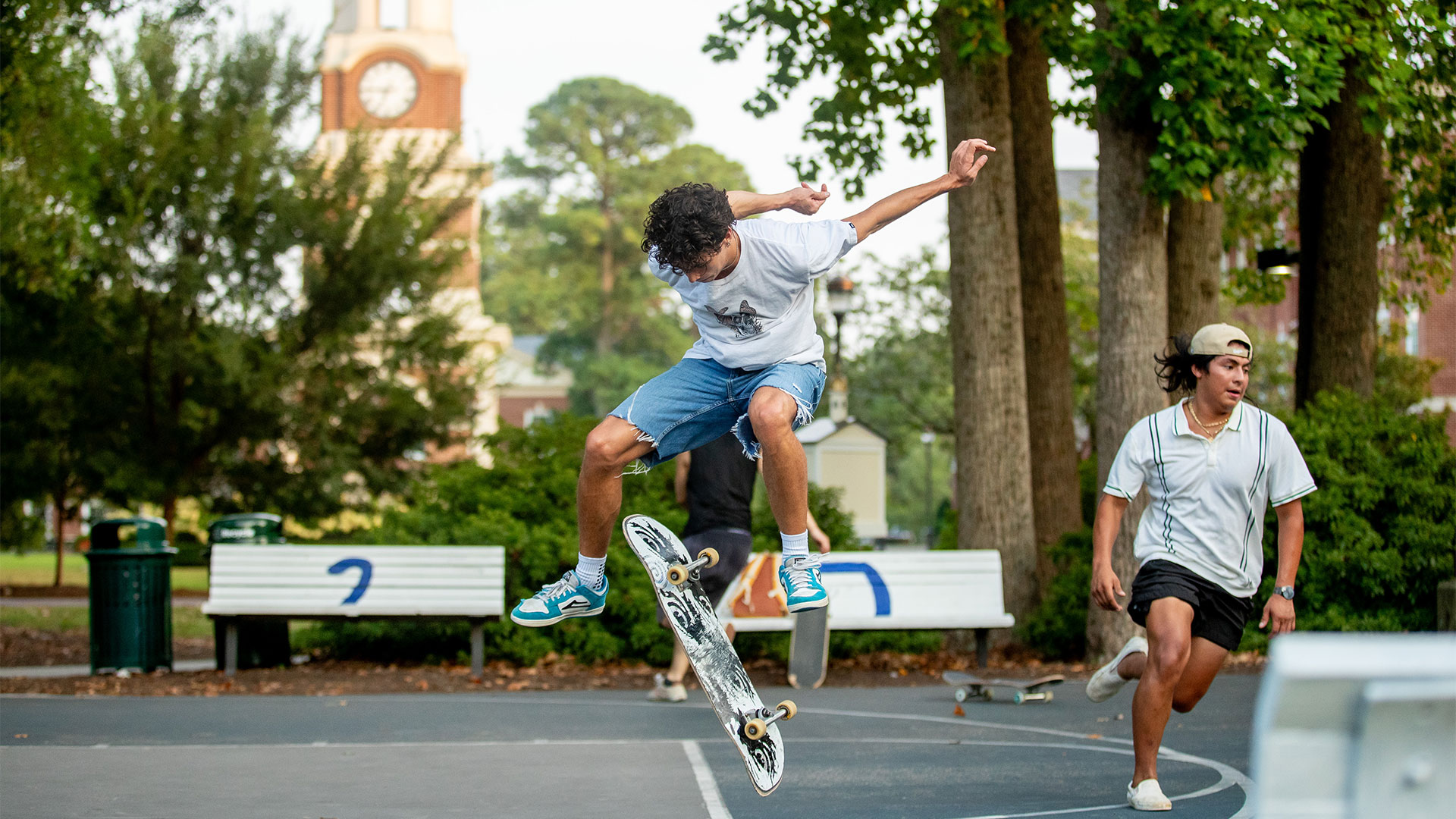 Students skateboard on the basketball courts at the Black Student Union Block Party.