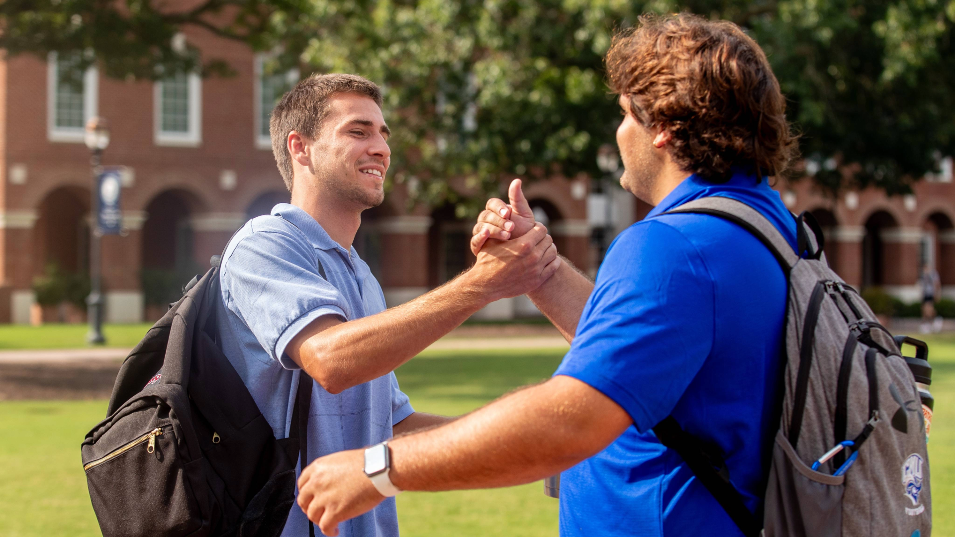Students greeting each other on campus