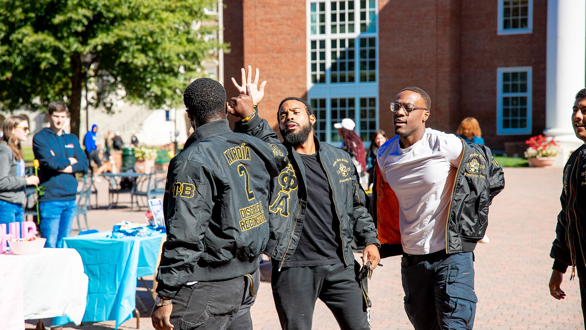 Greek Alphas outside of Trible Library.