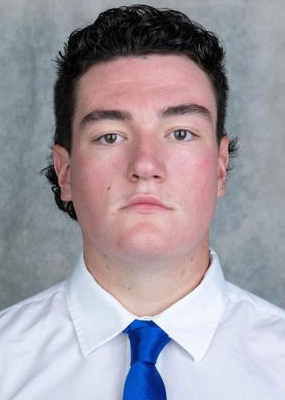 A headshot image of Anthony Atkins Jr. wearing a white collared shirt and blue tie.