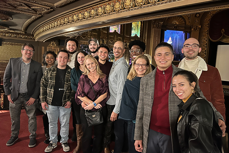 Brandon Davis '22 (center) stands amongst friends and family in Richmond.