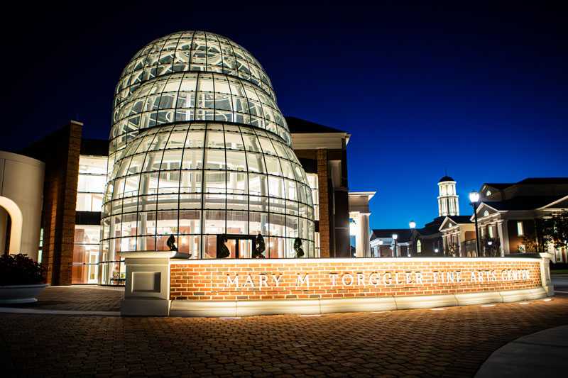 The Torggler Fine Arts Center at night.