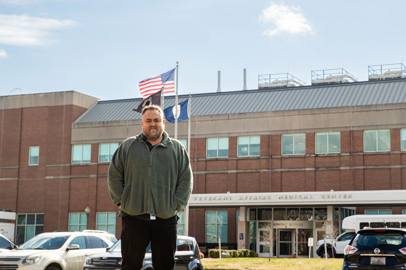 Jose Gonazalez Jr. stands outside of his work
