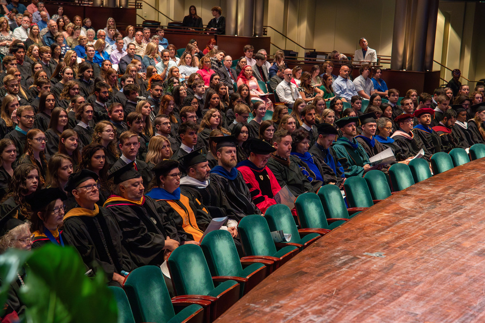 Faculty sit in the front of the Diamonstein Concert Hall.
