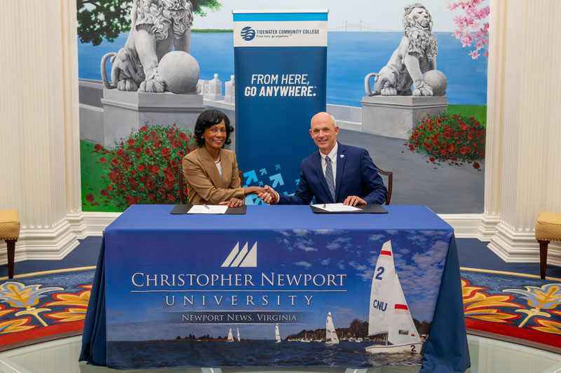 Tidewater Community College President Dr. Marcia Conston shakes hands with Christopher Newport President William Kelly