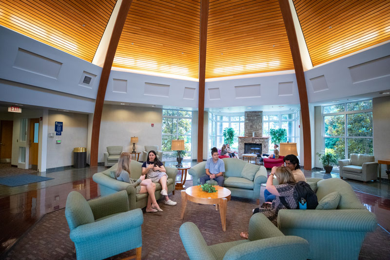 Students sit in a common space in York River Residence Hall.