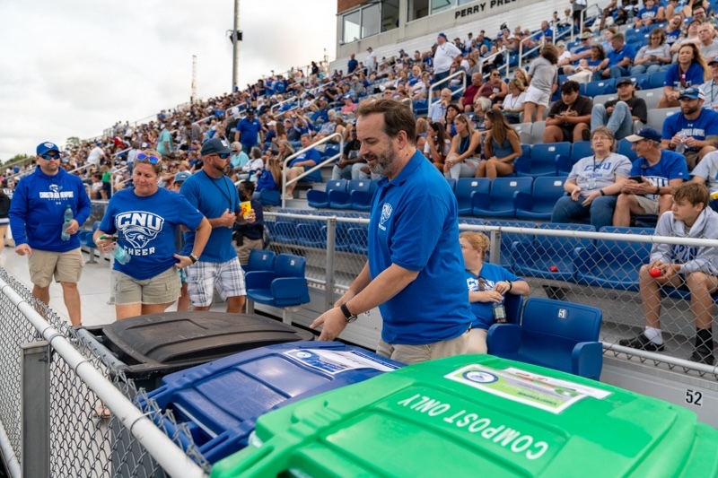 man throwing trash away