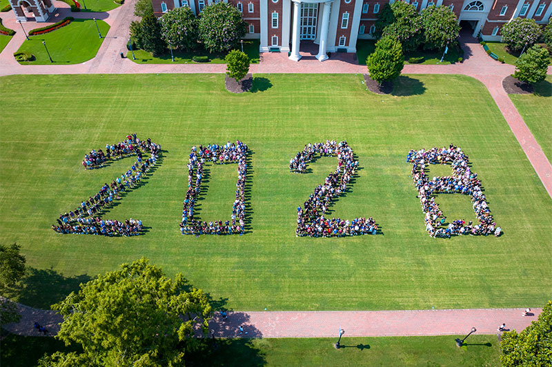 Aerial view of students making the numbers 2028