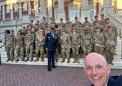 CNU President William G. Kelly takes a selfie with Join Chiefs of Staff Chairman General Charles ‘CQ’ Brown Jr. and ROTC cadets